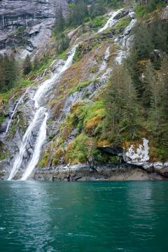 Falling waters enter the Endicott Arm in Alaska Stock Photos