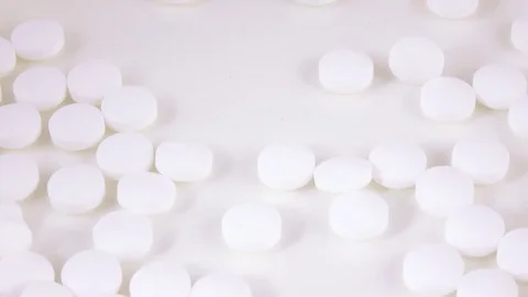 Falling white pills Stock Footage 74997402