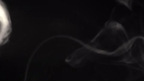 Falling white smoke ring  cloud isolated on black background Stock Footage 272172315