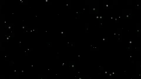 Falling white snowflakes drifting slowly across a solid black background for Video stock 345430135