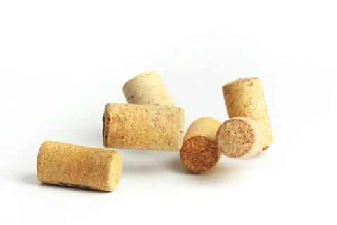 Falling wine bottle caps on a white background Photos