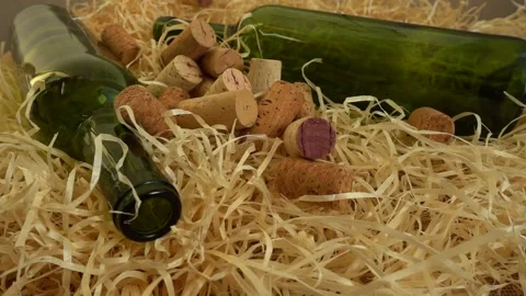 Falling wine corks on straw. Slow motion... | Stock Video | Pond5