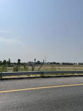 Fallow Fields Beside the Highway Stock Photos