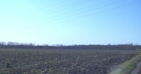 Fallow fields near Vigevano with the Alps in winter Stock Footage 121532875