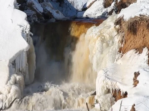 Falls among the snow in the winter Stock Footage 72357161