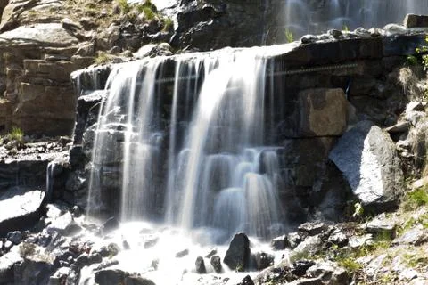 Falls in mountains Stock Photos