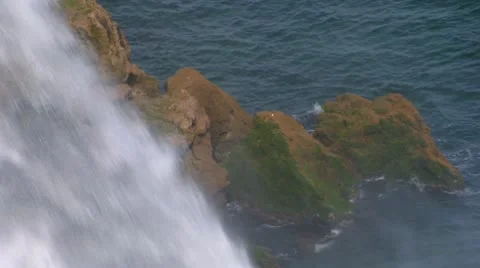 Falls. Streams of river water break from rock and fall to sea Stock Footage 8966326