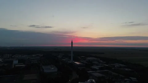 Fallturm Bremen drop tower against a dramatic pink sunset sky 動画素材 337970651