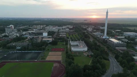 Fallturm Bremen drop tower over the campus and sports fields at sunset Video stock 337970766