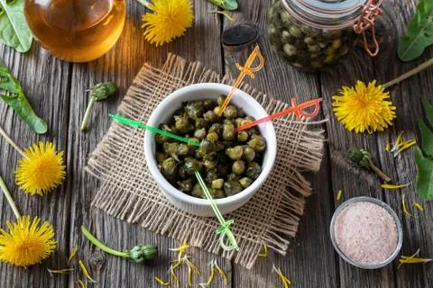 False capers made from young dandelion buds in a bowl Stock Photos