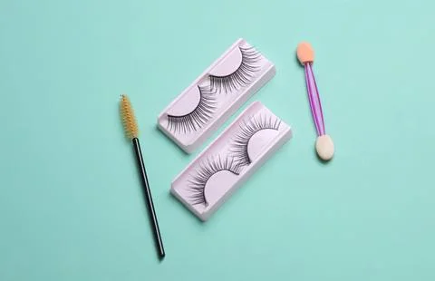 False eyelashes in boxes with mascara and applicator tools Stock Photos