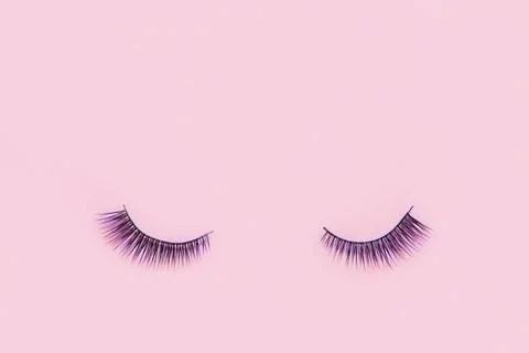False eyelashes on pink colour background with copy space False eyelashes ... Stock Photos