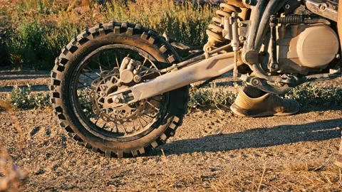 False start of biker on Powerful enduro motorcycle starting kicking up dust Stock Footage 194420729