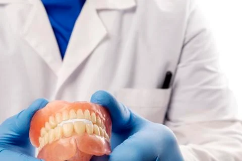 False teeth prosthesis. Doctor Dentist. Stock Photos