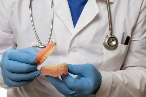 False teeth prosthesis. Doctor Dentist. Stock Photos