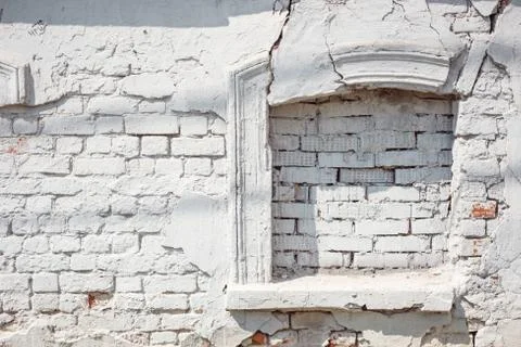 False window made of white brick, cracked ancient wall. Design element. Stock Photos