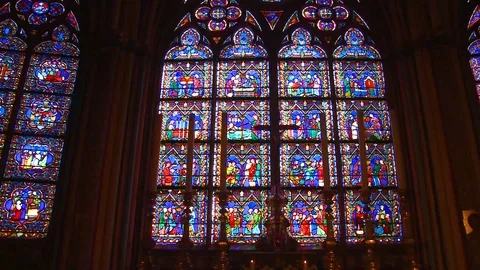 Famed stained glass windows inside the Notre Dame Cathedral in Paris. Stock Footage 106632725