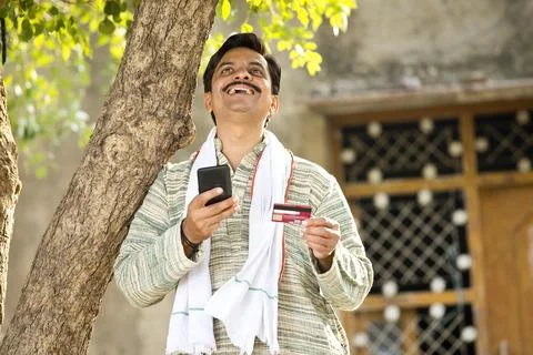 Famer using mobile phone and credit card for payment Stock Photos