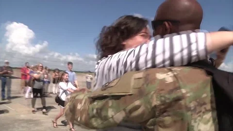 Families embrace on return from deployment Video stock 90164574