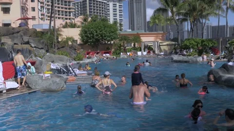 Families Having Fun In Resort Pool At Sheraton Waikiki, Honolulu, Hawaii Stock Footage 154356090