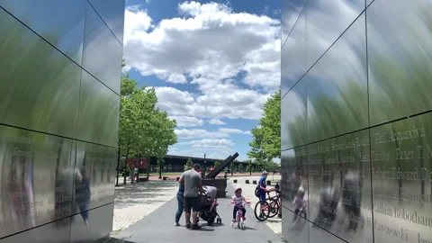 Families Visit the Empty Sky September 11th Memorial in Jersey City Stock Footage 133465564