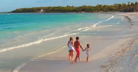 Family and Children Walk Together Along Tropical Beach Stock Footage