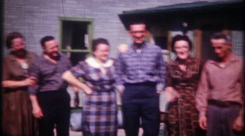 Family and friends pose together for photos  1950s vintage film home movie 2361 Stock Footage