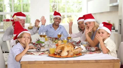 Family around the dinner table at christmas Stock Footage