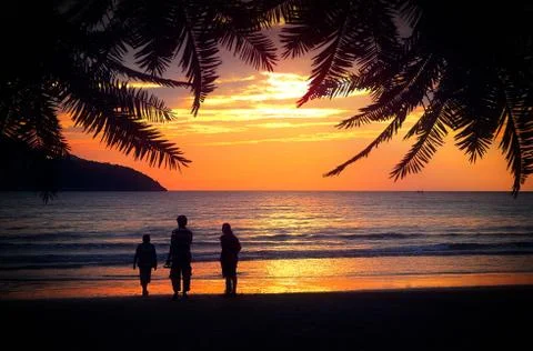 Family on the Beach at Sunset - Holidays - Tropical Setting - Photo Illustrat Stock Photos