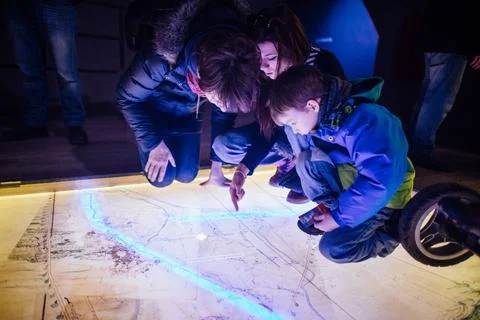 Family bonding, shared learning through interactive play. Parents and children Stock Photos