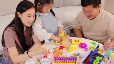 Family Bonding Through Educational Games at Home Stock Footage 323787332
