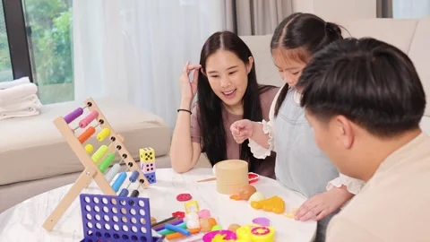 Family Bonding Through Educational Games at Home Stock Footage 329460198