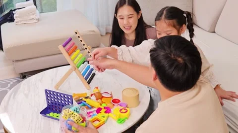 Family Bonding Through Educational Games at Home Stock Footage 330094285