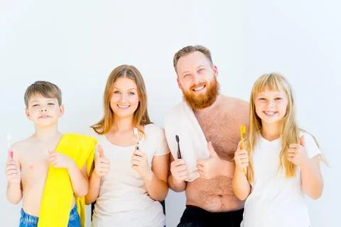 Family brushing teeth Stock Photos