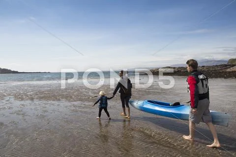 Family With Canoe On Beach, Loch Eishort, Isle Of Skye, Hebrides, Scotland