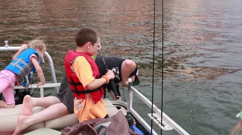 Family catching fish on a boat, slow HD  Stock Footage