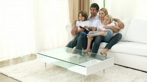 Family celebrating a goal at home Stock Footage