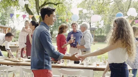 Family celebration or a garden party outside in the backyard. Stock Footage