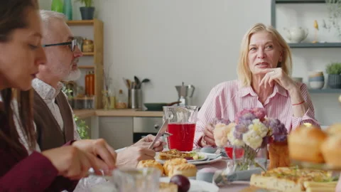 Family Chatting over Easter Dinner at Home Stock Footage 224556455