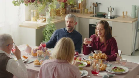 Family Clinking Glasses on Easter Dinner Stock Footage 224564370