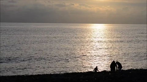 Family on a cold beach Stock Footage 70423446