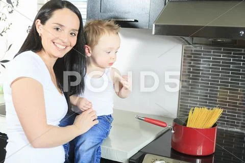 Family Cook Pasta Inside The Kitchen