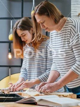 Family cooking hobby biscuits cookery book recipe Stock Photos