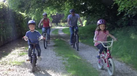 Family On Cycle Ride In Countryside Stock Footage