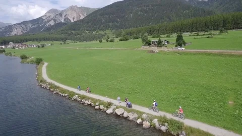Family Cyclists on a cycle path Stock Footage 129427264
