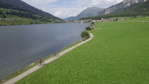 Family Cyclists on a cycle path Stock Footage 129427293