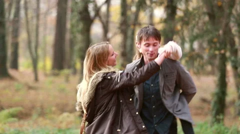 Family dancing in park, father carrying daughter on his back Stock Footage 59554405
