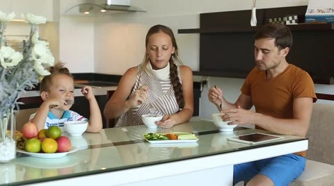 Family dinner together at the table Stock Footage 57799486