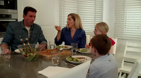 Family at dinning table. Stock Footage 64107388