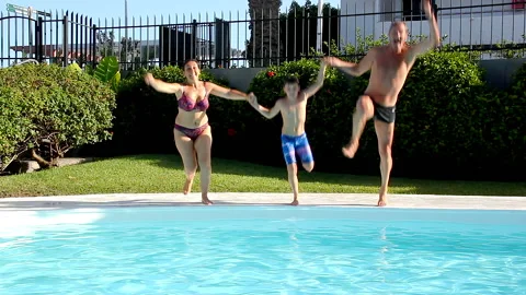 Family diving swimming pool by Josu Ozkaritz Stock Footage